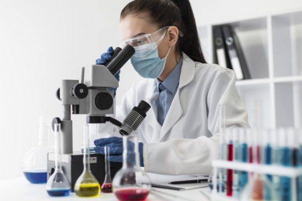 medium-shot-woman-looking-through-microscope_23-2148926618